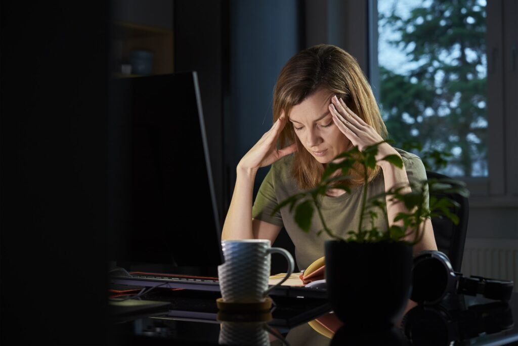Woman working late remotely at home